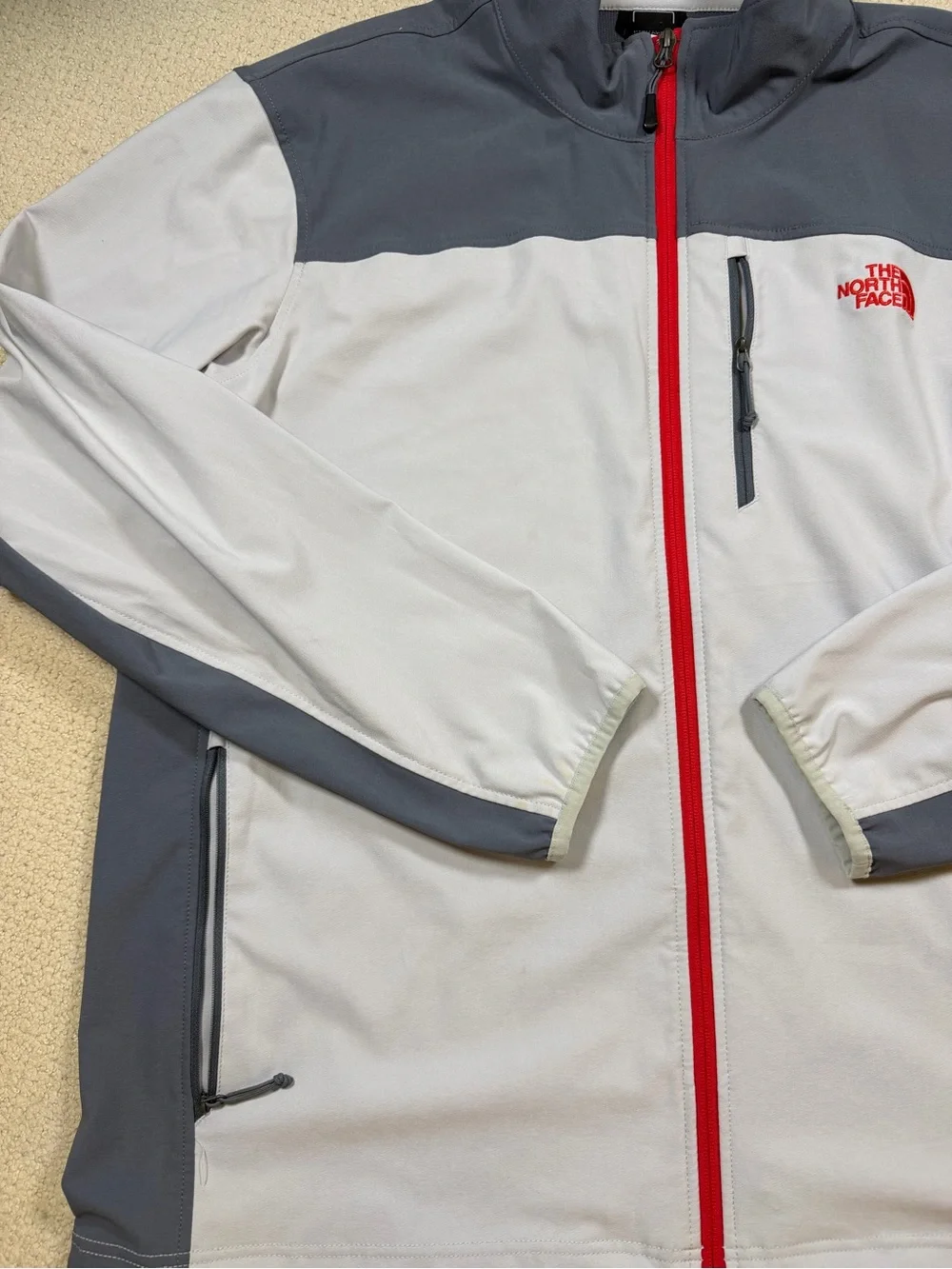 The North Face Men’s Gray Jacket with Red Zipper